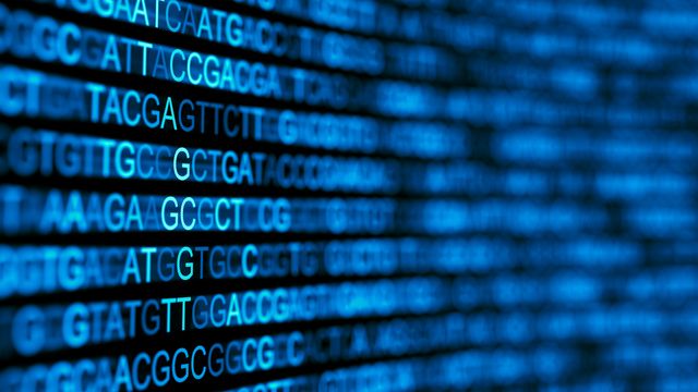 Close-up of glowing blue DNA sequence data representing genetic code for genomic analysis 